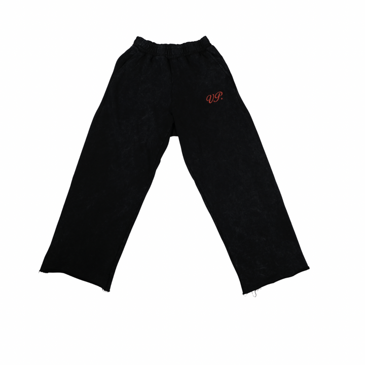 Black pant with a orange logo on a white background