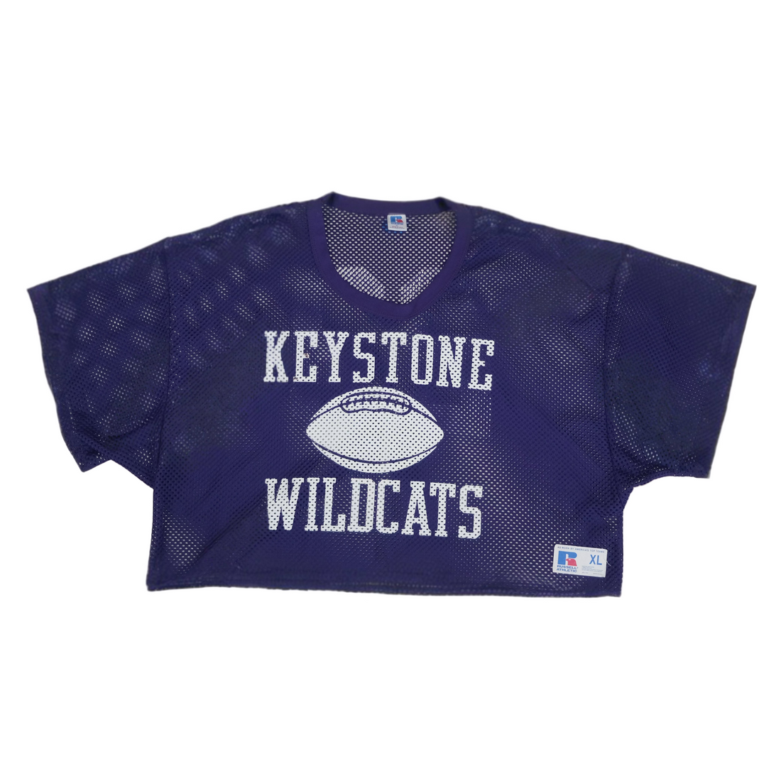 Purple mesh sports jersey with 'Keystone Wildcats' text on a beige background