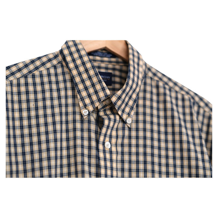 close-up of midnight and butter check cotton fabric with collar detail