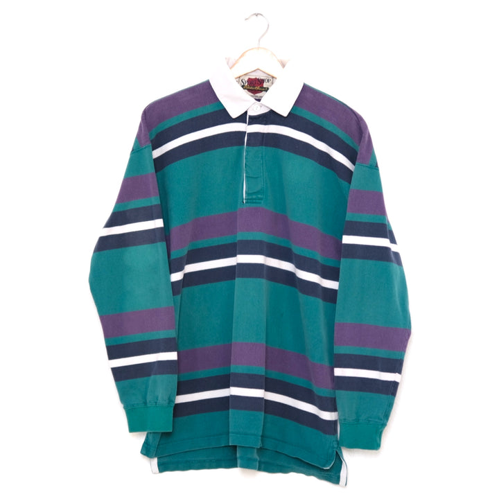 vintage 90s rugby in teal, plum, midnight and shell graphic stripes with shell contrast collar, on a wood hanger