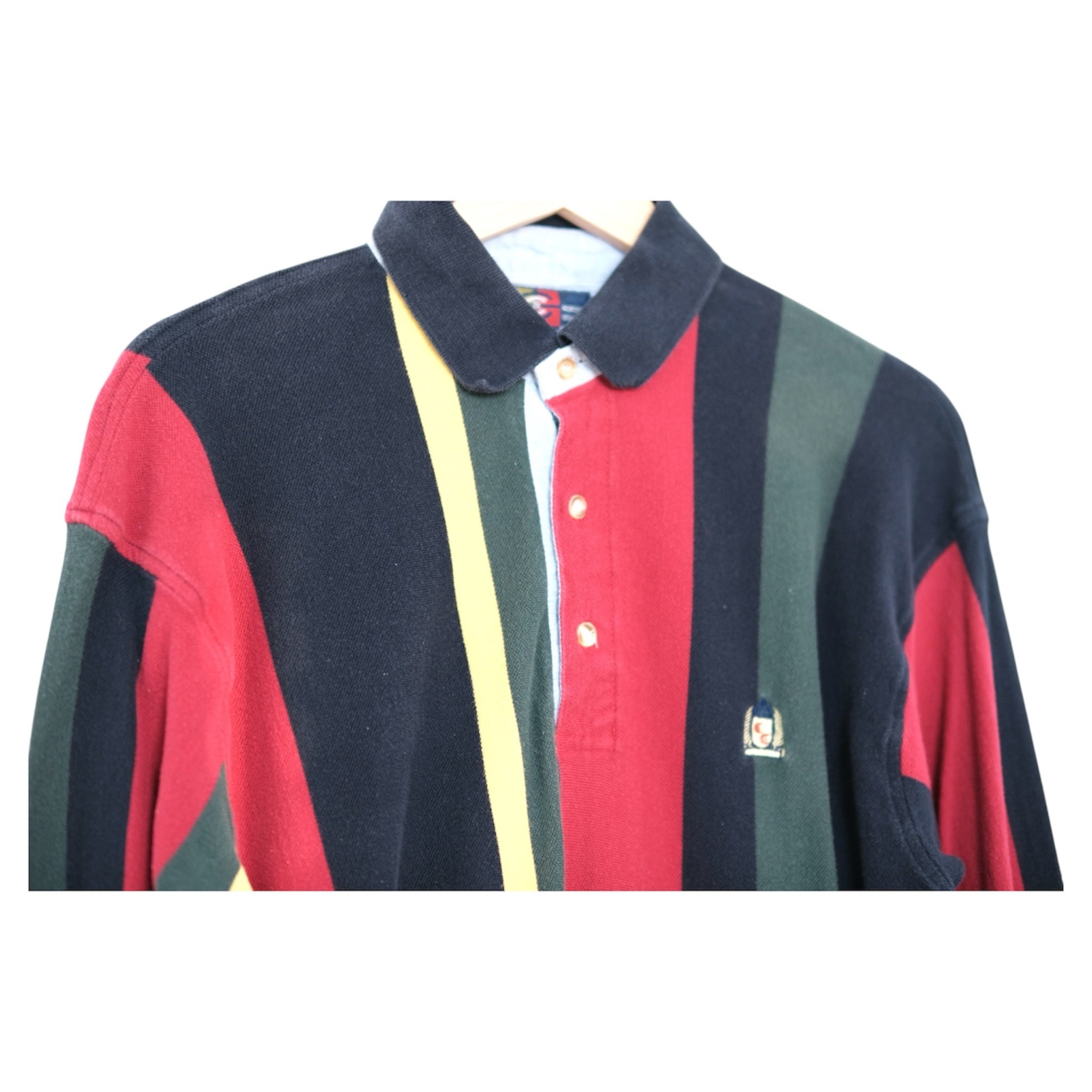 close-up of rugby collar with three-button placket and chambray facing, embroidered chest detail