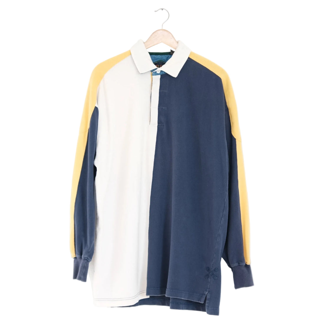 long-line colorblock rugby in navy, cream and butter with contrast raglan sleeves, on a wood hanger