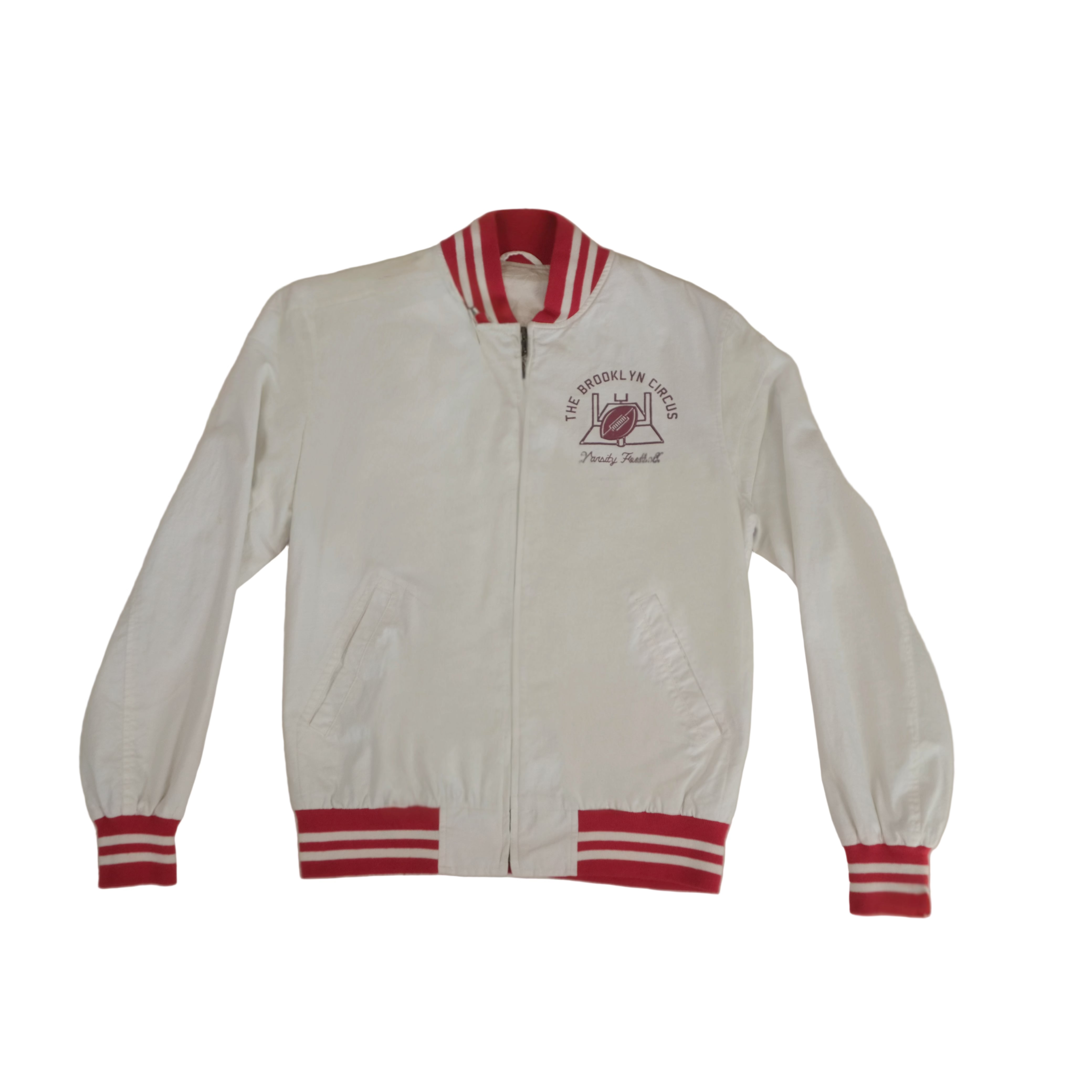 White jacket with red accents and a logo on a light background