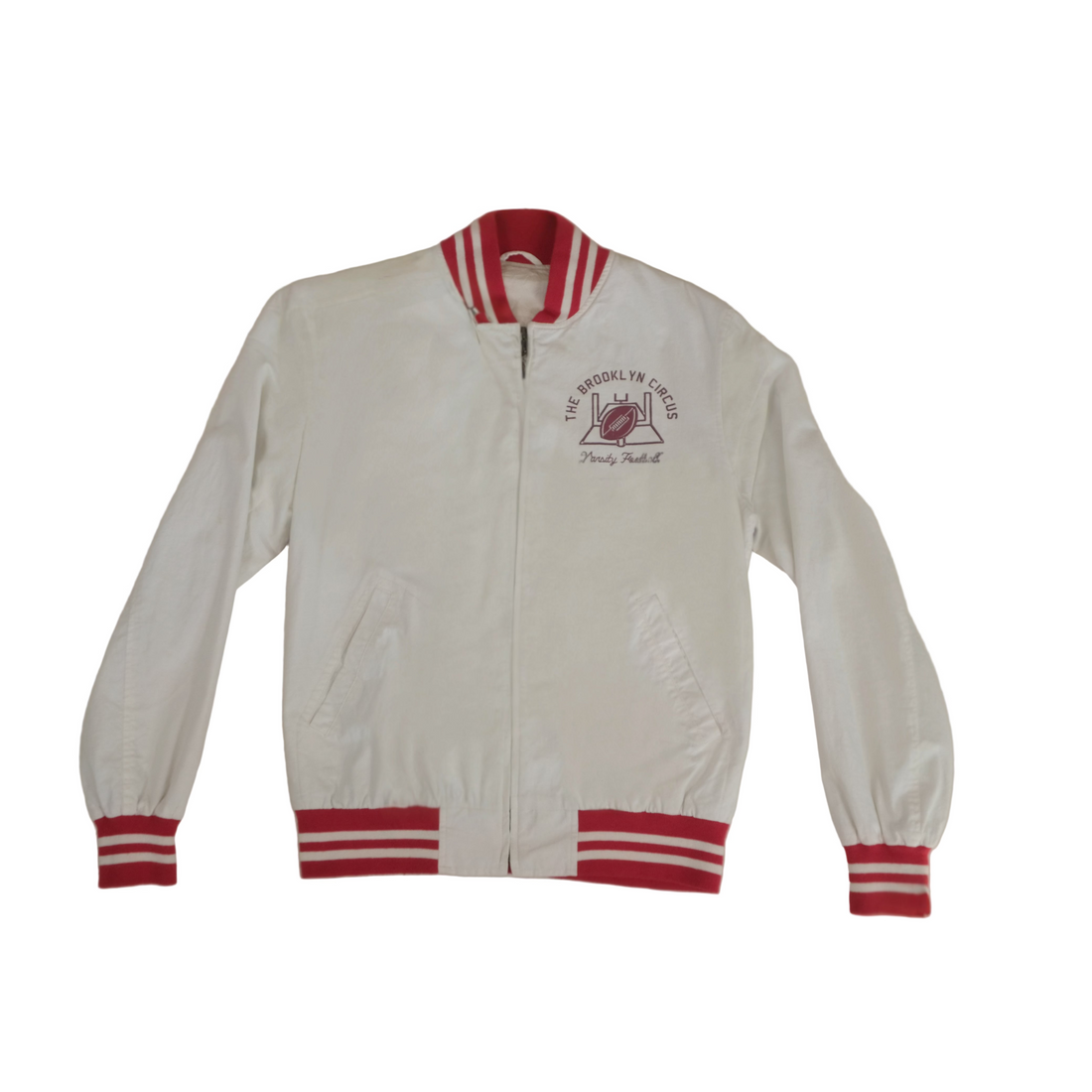 White jacket with red accents and a logo on a light background